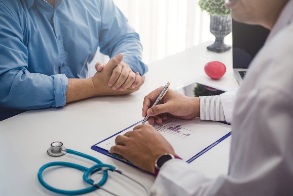 Doctor consultation with male patient health disease in medical