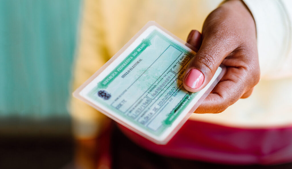 July 4, 2020, Brazil. Woman holds the Voter License (Título Ele