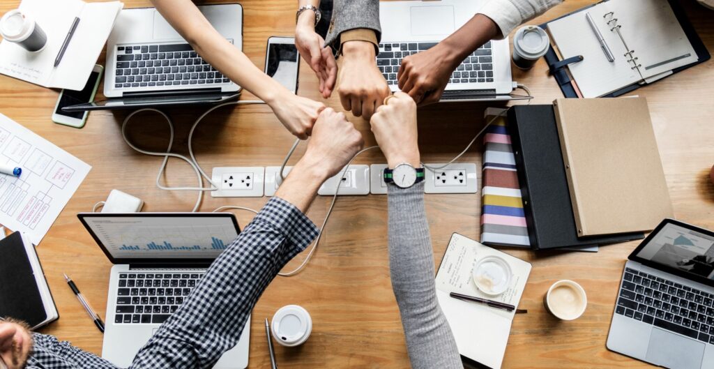 Colleagues giving a fist bump Colleagues giving a fist bump