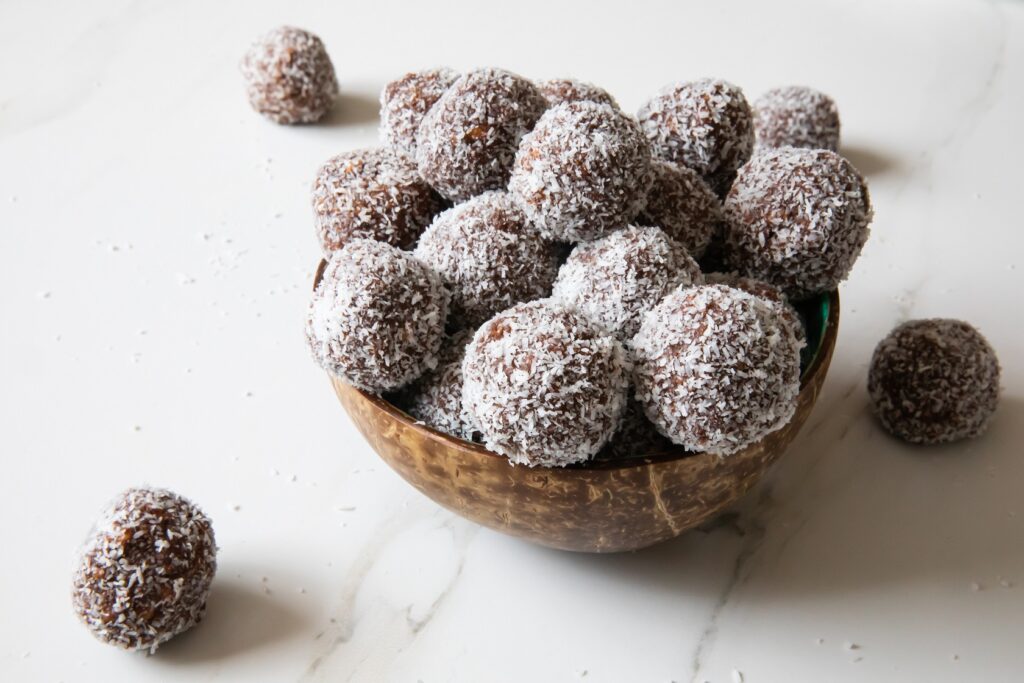 Delicious,Coconut-chocolate,Balls,Covered,With,Grated,Coconut,Served,In,A Delicious,Coconut-chocolate,Balls,Covered,With,Grated,Coconut,Served,In,A