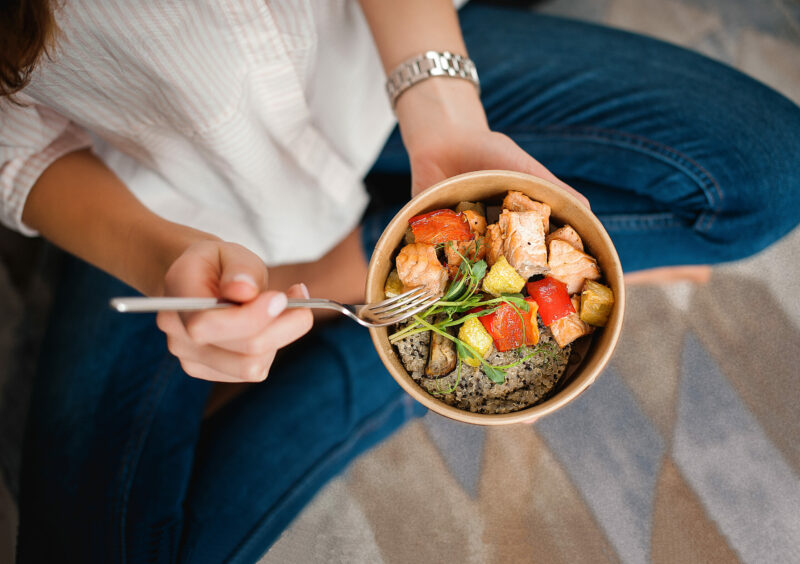Girl,Holds,A,Paper,Plate,With,Healthy,Food,Sitting,On