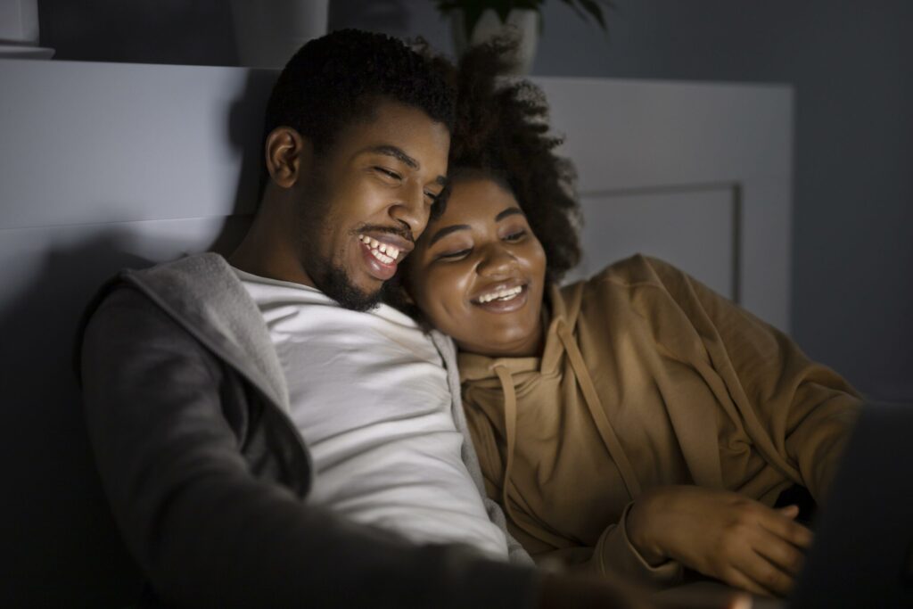 african-american-couple-watching-netflix-together-scaled