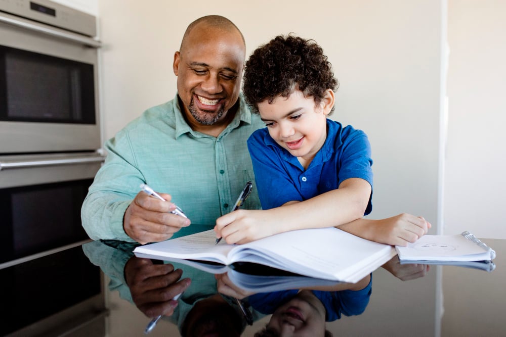 boy-getting-homeschooled-by-his-father-in-the-new-normal boy-getting-homeschooled-by-his-father-in-the-new-normal