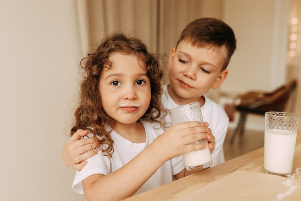 children-drink-milk-boy-and-girl-brother-and-sis-2021-08-29-20-45-30-utc-scaled
