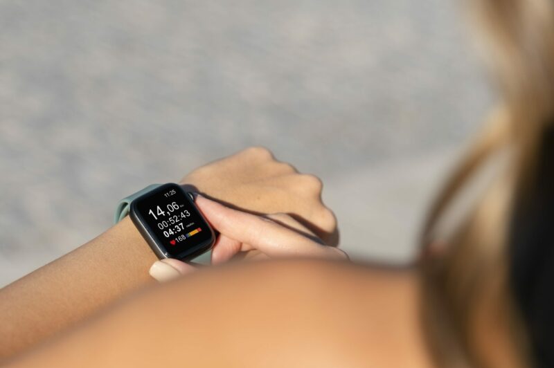 close-up-hand-wearing-smartwatch-min-scaled-e1646242103490