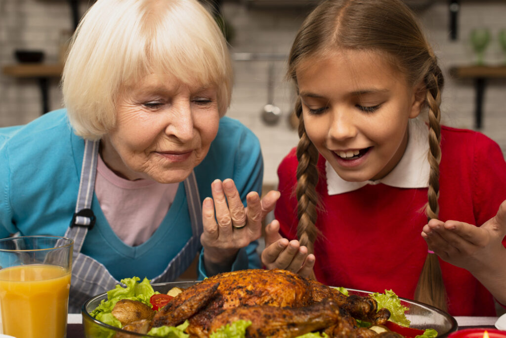 close-up-of-grandmother-and-granddaughter-smelling-the-food-scaled close-up-of-grandmother-and-granddaughter-smelling-the-food-scaled