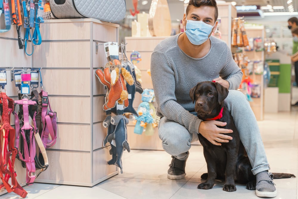 cute-dog-with-owner-at-the-pet-shop