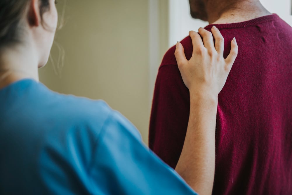 female-nurse-touching-a-patients-shoulder