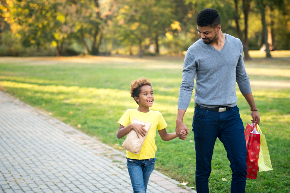 happy-family-holding-hands-and-walking-together-in-the-park