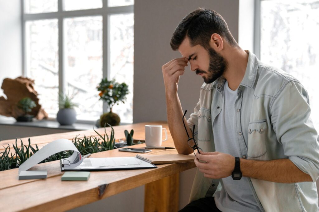 Male businessman concentrates on documents in office Male businessman concentrates on documents in office