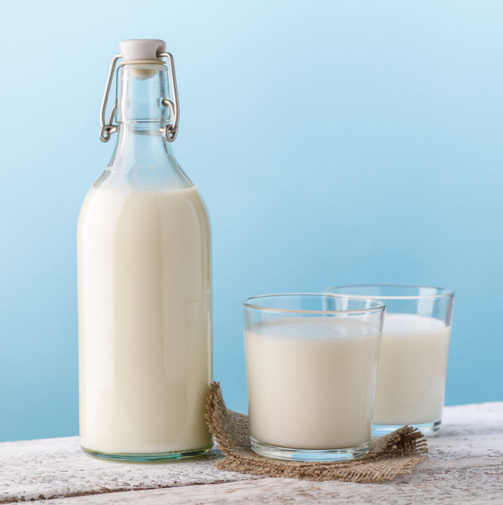 Milk. Bottle and glass with milk.