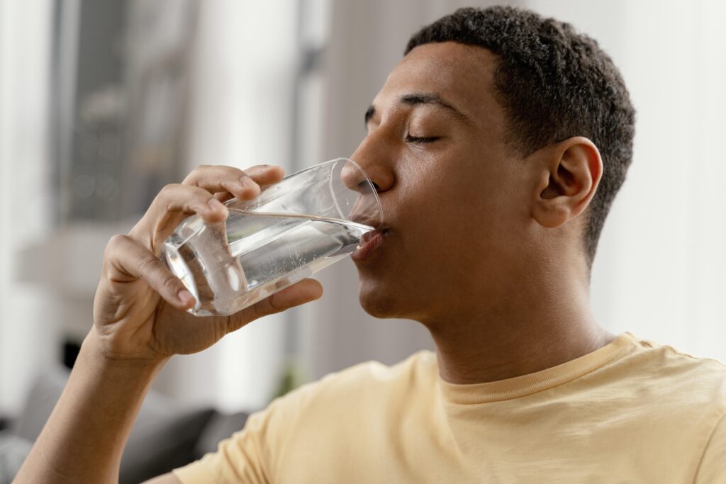 portrait-man-at-home-drinking-glass-of-water portrait-man-at-home-drinking-glass-of-water