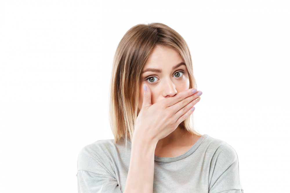 pretty-young-young-woman-covering-her-mouth-with-hand