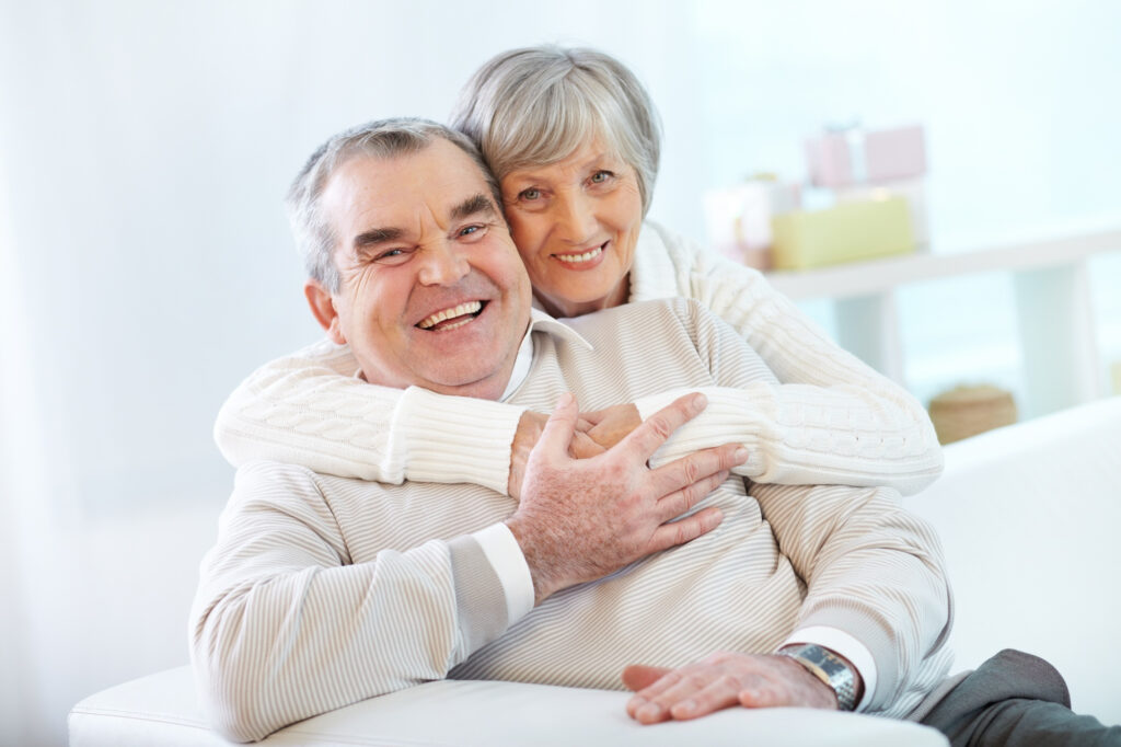 senior-couple-hugging-at-home