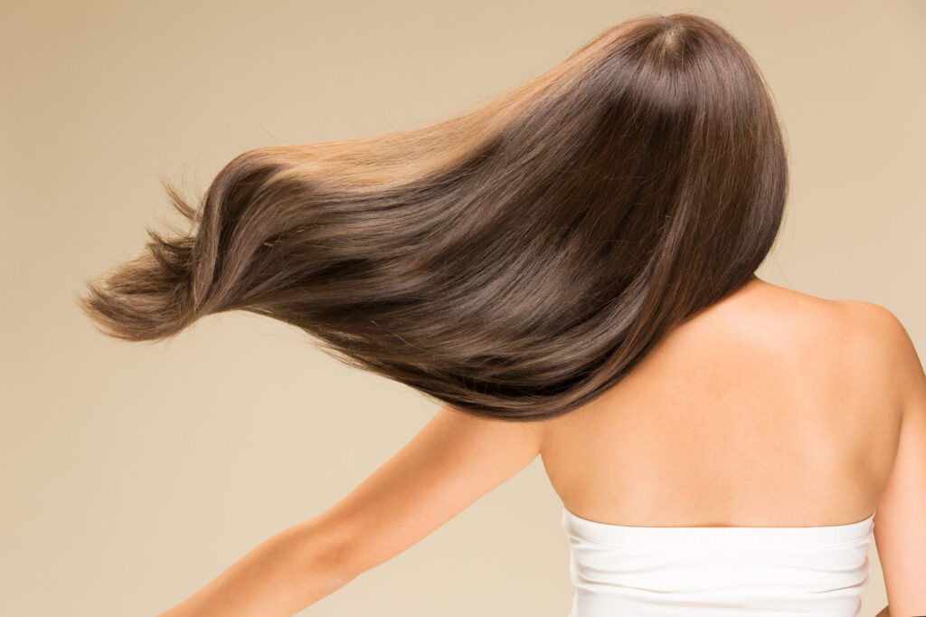 Lively,Hair,On,A,Beige,Background.