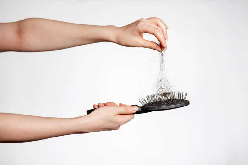 Females,Hands,Clean,The,Comb,From,Fallen,Hair.,Close,Up.