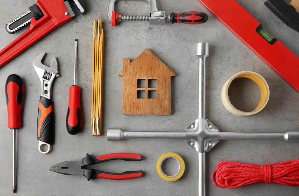 Flat,Lay,Composition,With,House,Figure,And,Repair,Tools,On