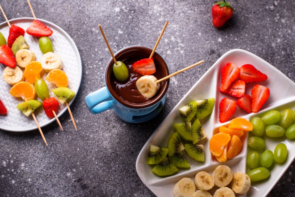 Sweet chocolate fondue with fruits Sweet chocolate fondue with fruits