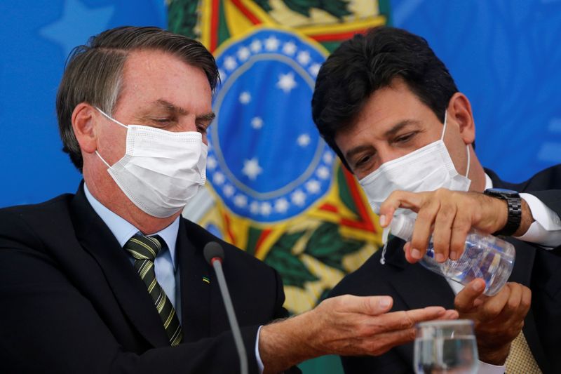 Presidente Jair Bolsonaro e então ministro da Saúde, Luiz Henrique Mandettas