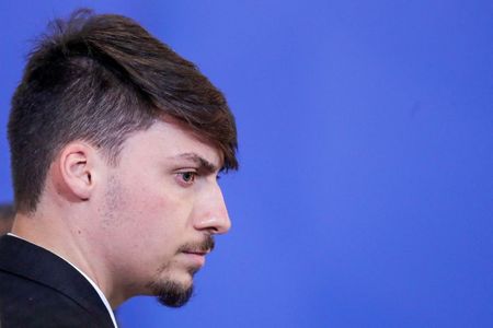 Jair Renan, filho mais novo do presidente Jair Bolsonaro, em cerimôna no Palácio do Planalto