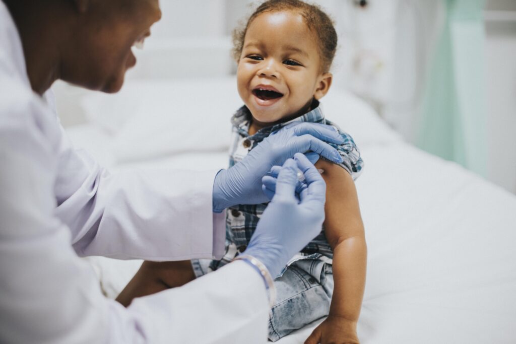 toddler-getting-vaccination-by-pediatrician-min