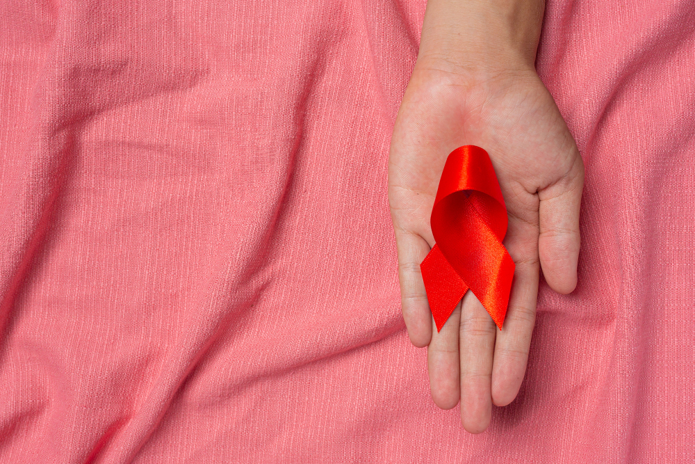 woman-hand-holding-red-ribbon-hiv-awareness-concept-world-aids-day-and-world-sexual-health-day woman-hand-holding-red-ribbon-hiv-awareness-concept-world-aids-day-and-world-sexual-health-day