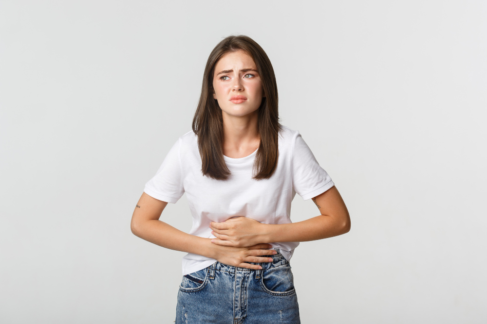 woman-having-stomach-ache-bending-and-with-hands-on-belly-discomfort-from-menstrual-cramps woman-having-stomach-ache-bending-and-with-hands-on-belly-discomfort-from-menstrual-cramps