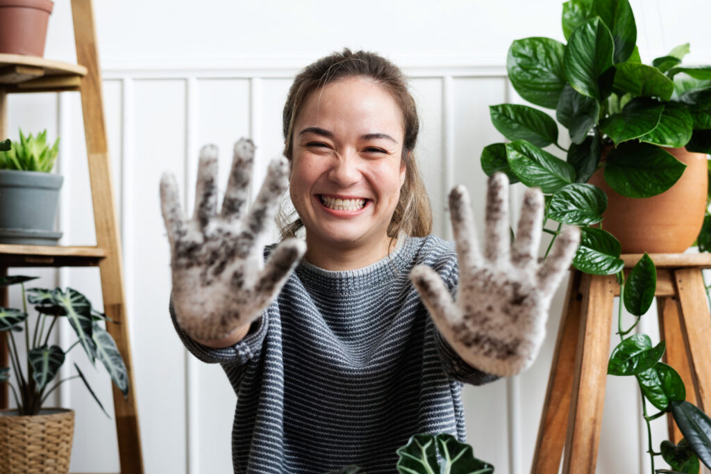 woman-showing-her-soiled-gardening-glove-scaled woman-showing-her-soiled-gardening-glove-scaled
