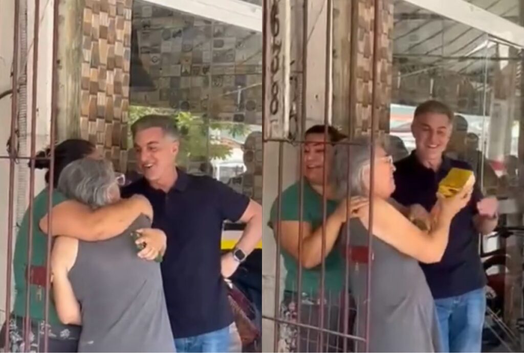 Luciano Huck entregando prêmio de R$ 1 milhão para moradora de Matinhos