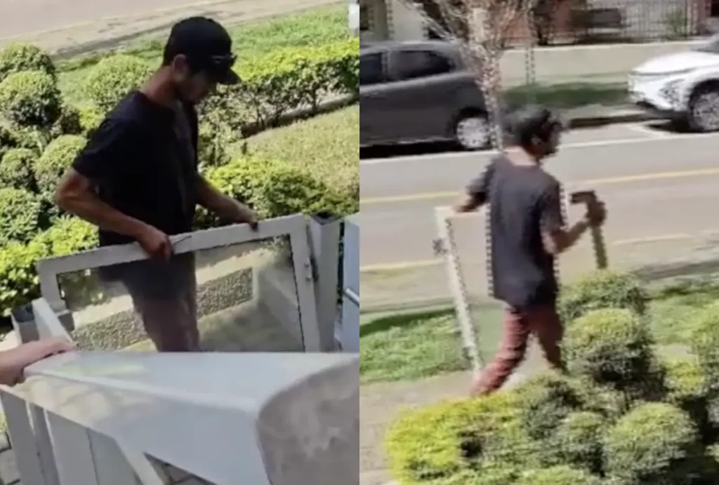 homem carregando portao depois de furtá-lo em curitiba
