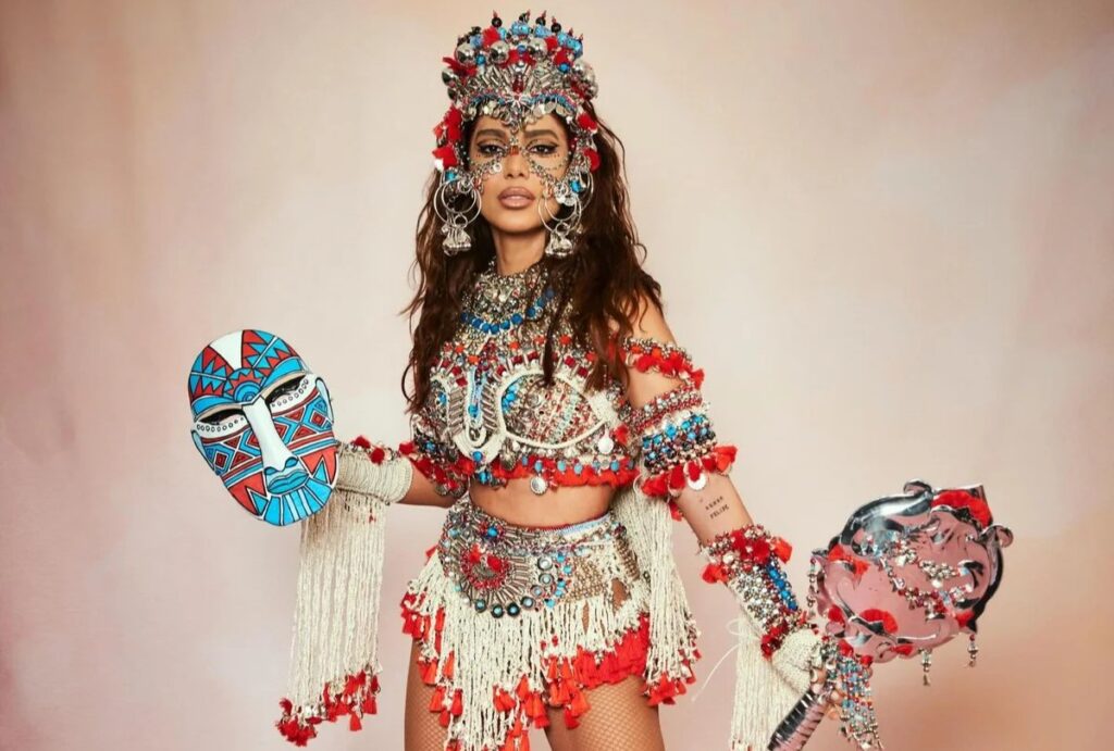 Anitta aceita convite da Grande Rio e assume posto de rainha de bateria para o Carnaval 2027. Veja como foi a negociação e data da coroação.